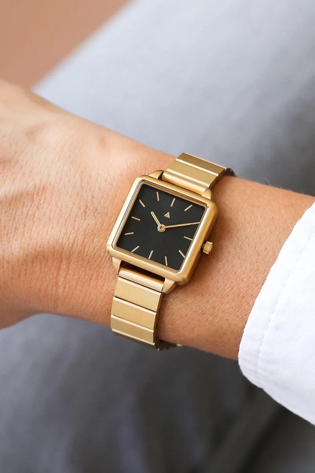 Rectangle watch with a golden strap