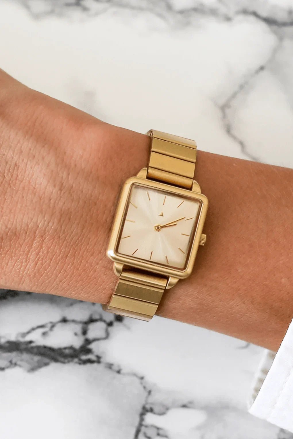 Rectangle watch with a golden strap