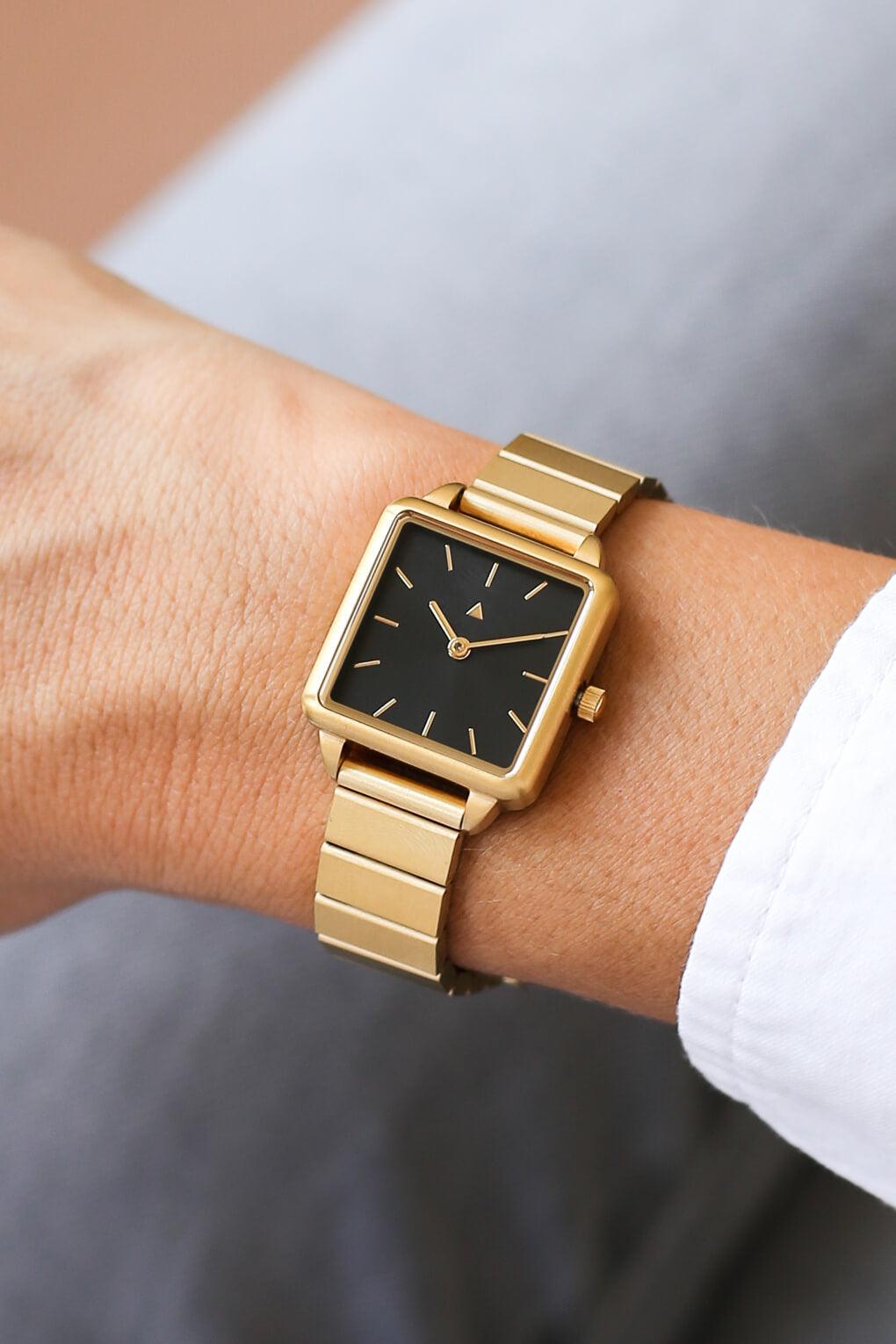 Rectangle watch with a golden strap