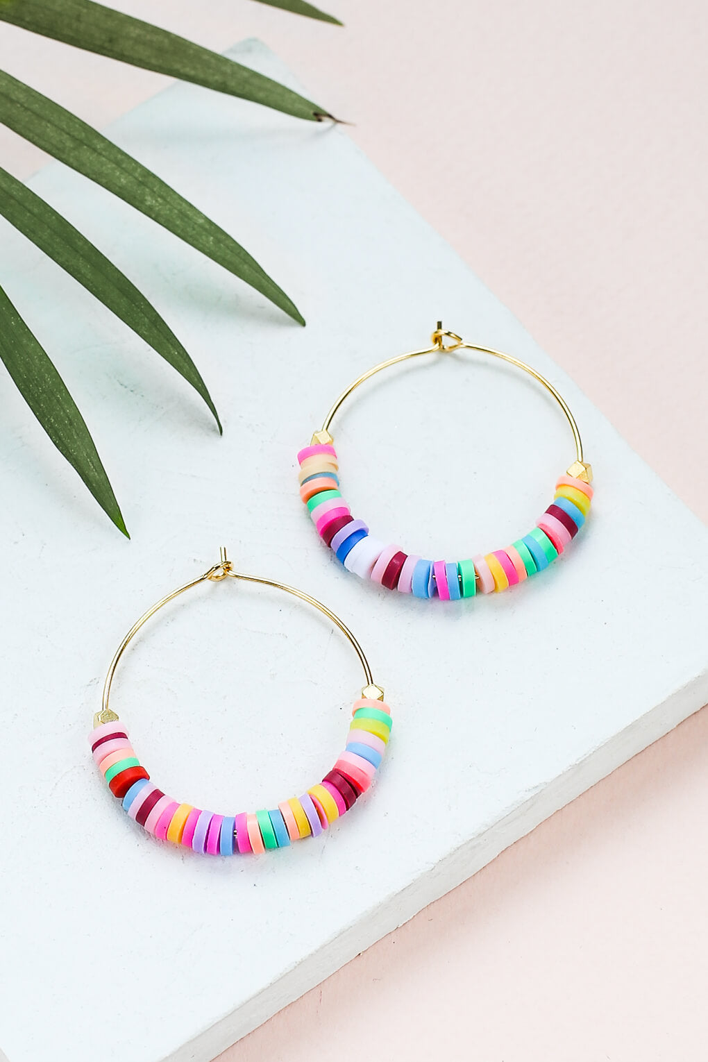 - Hoop earrings decorated with colorful silicone beads, 30 mm in