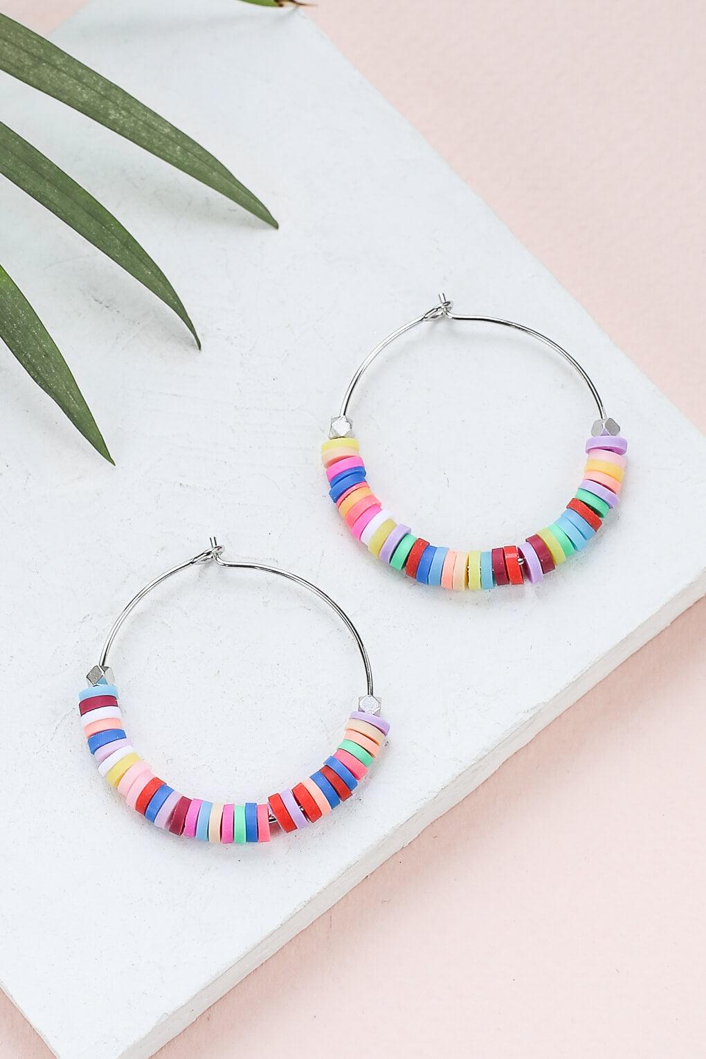 - Hoop earrings decorated with colorful silicone beads, 30 mm in